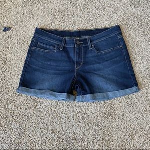 Levi Strauss & Co blue jean shorts.